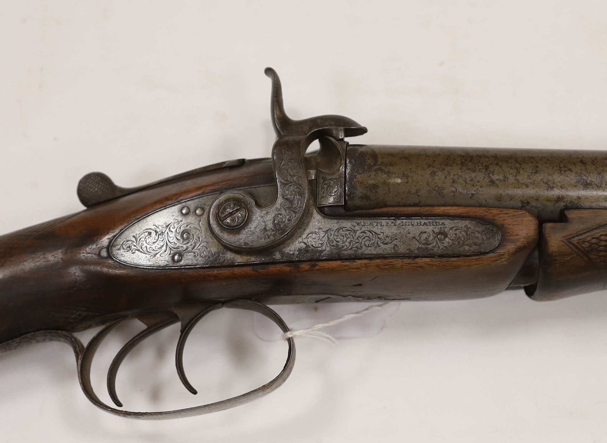 A double barrel pinfire shotgun by Wesley Richards with patent knuckle joint and top lever, barrels 74.5cm